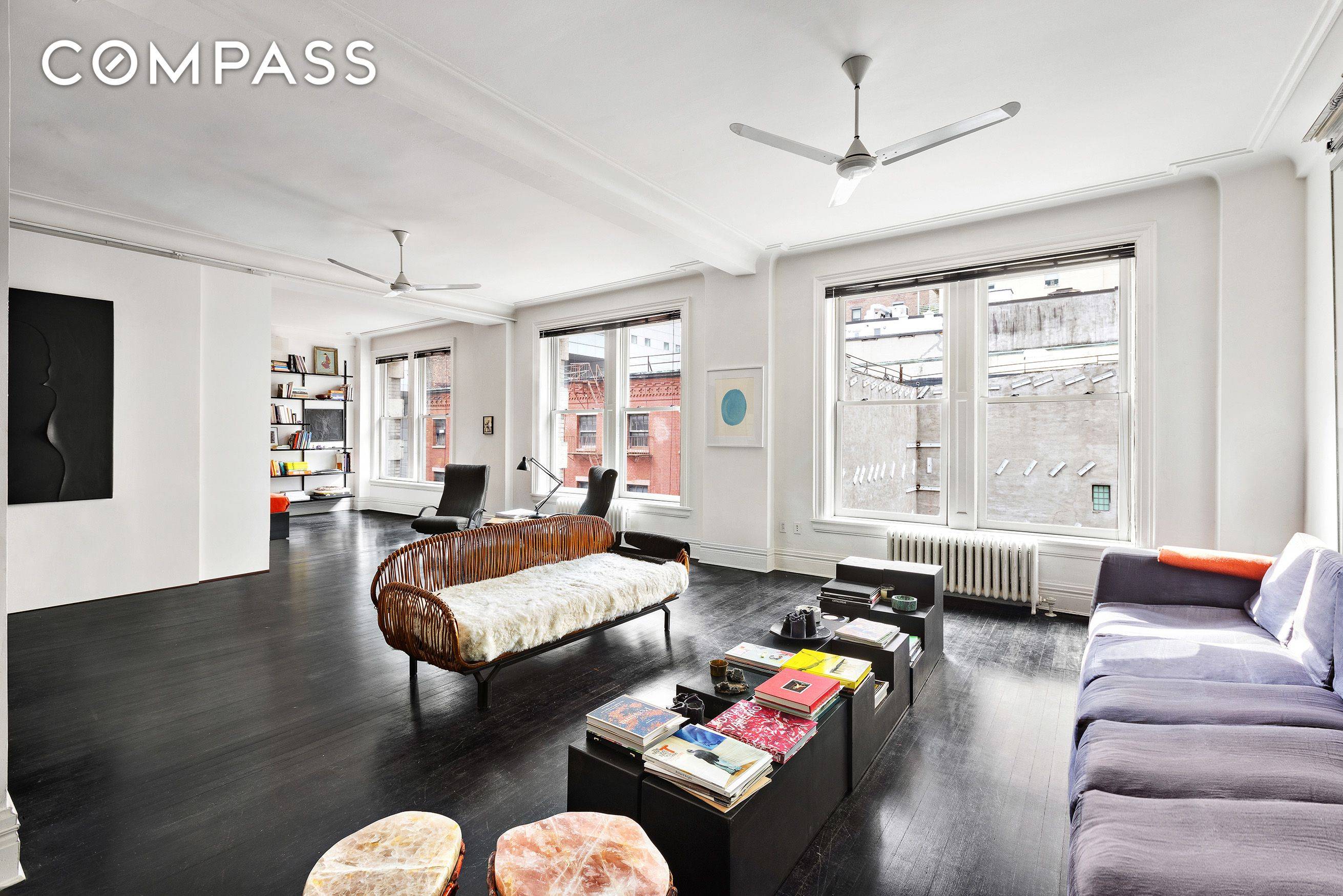 Old world charm seamlessly harmonizes with modernized loft living in this impeccably renovated by world renowned designers Locatelli Partners at this TriBeCa home.