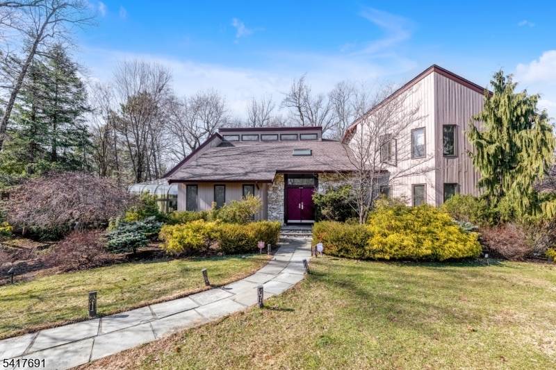 Dramatic, bright, and beautifully renovated contemporary home set on one of North Caldwell's most sought after streets.