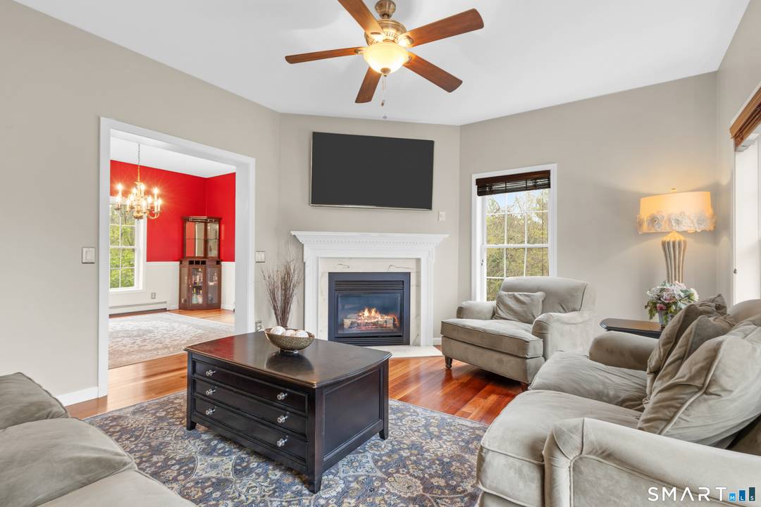 Set far off the road down a beautifully paved driveway, this classic New England Colonial offers the perfect blend of privacy, charm, and desirable location.