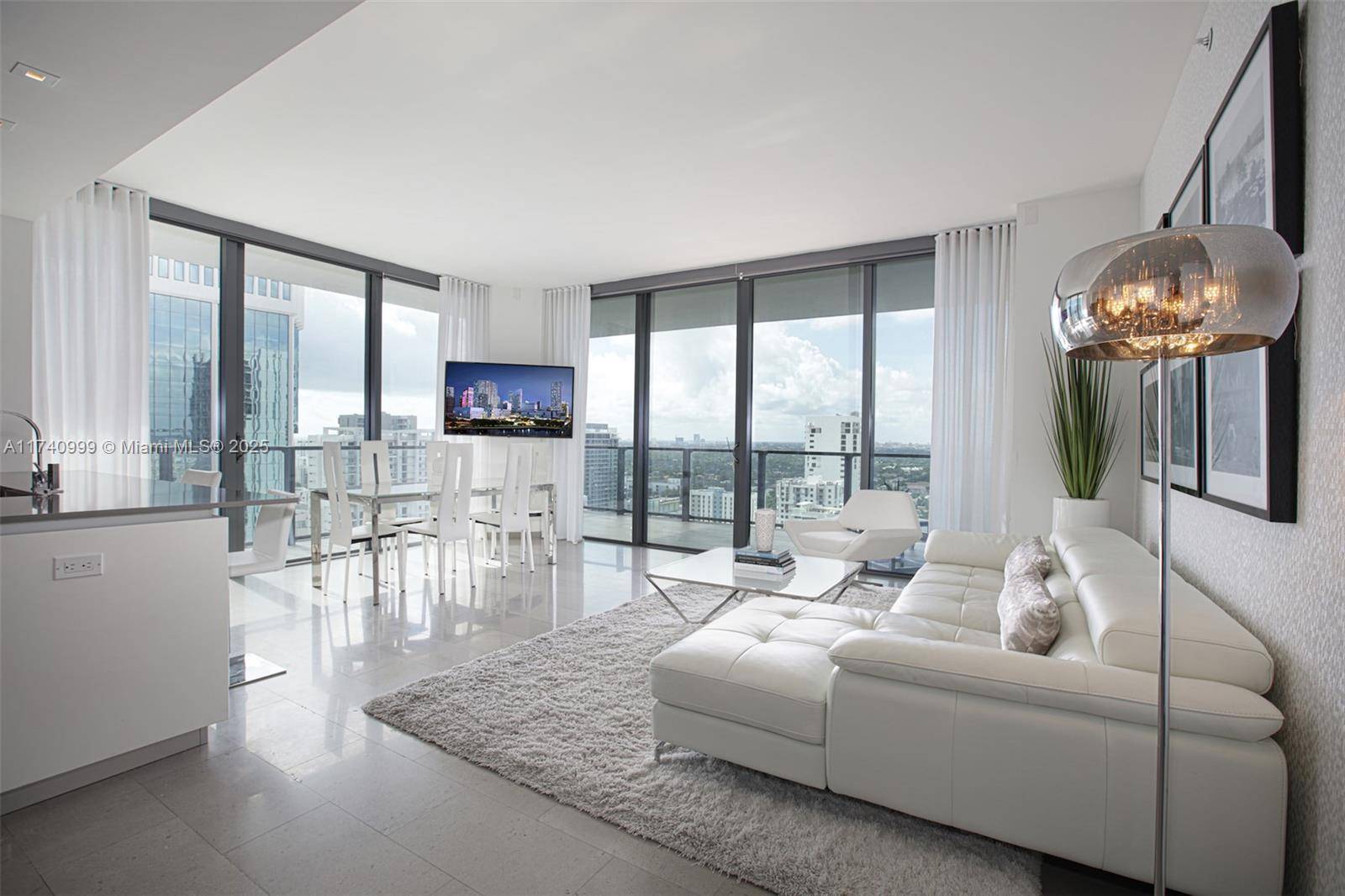 The ultimate luxury living, step into a modern welcoming foyer leading you into an open concept corner unit with floor to ceiling impact windows facing southwest views w a slight ...