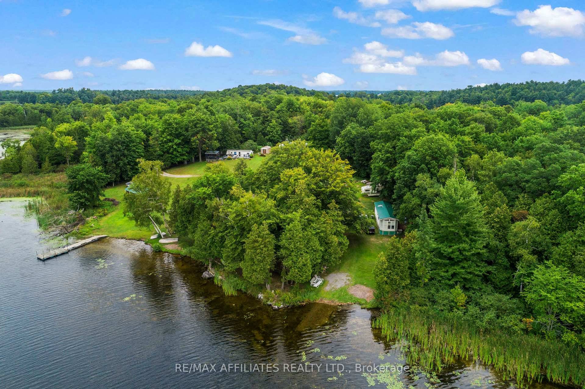Escape to Your Lakeside Paradise with over 900 Feet of Waterfront on Mosquito Lake connected to the Rideau System !