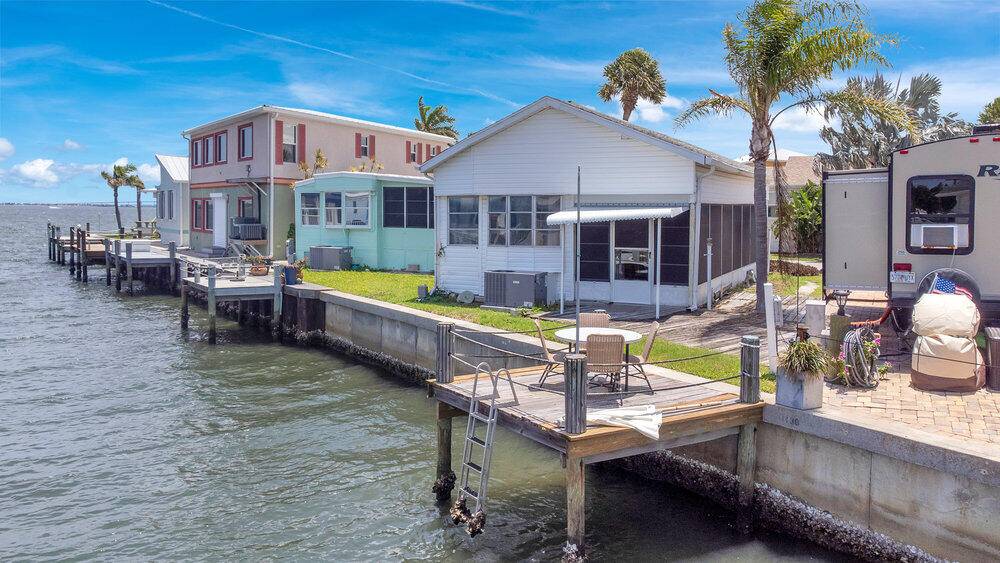 Welcome to paradise ! Located in the coveted guard gated Nettles Island on Hutchinson Island, this charming 2 1 waterfront home sits just four doors from the Indian River.