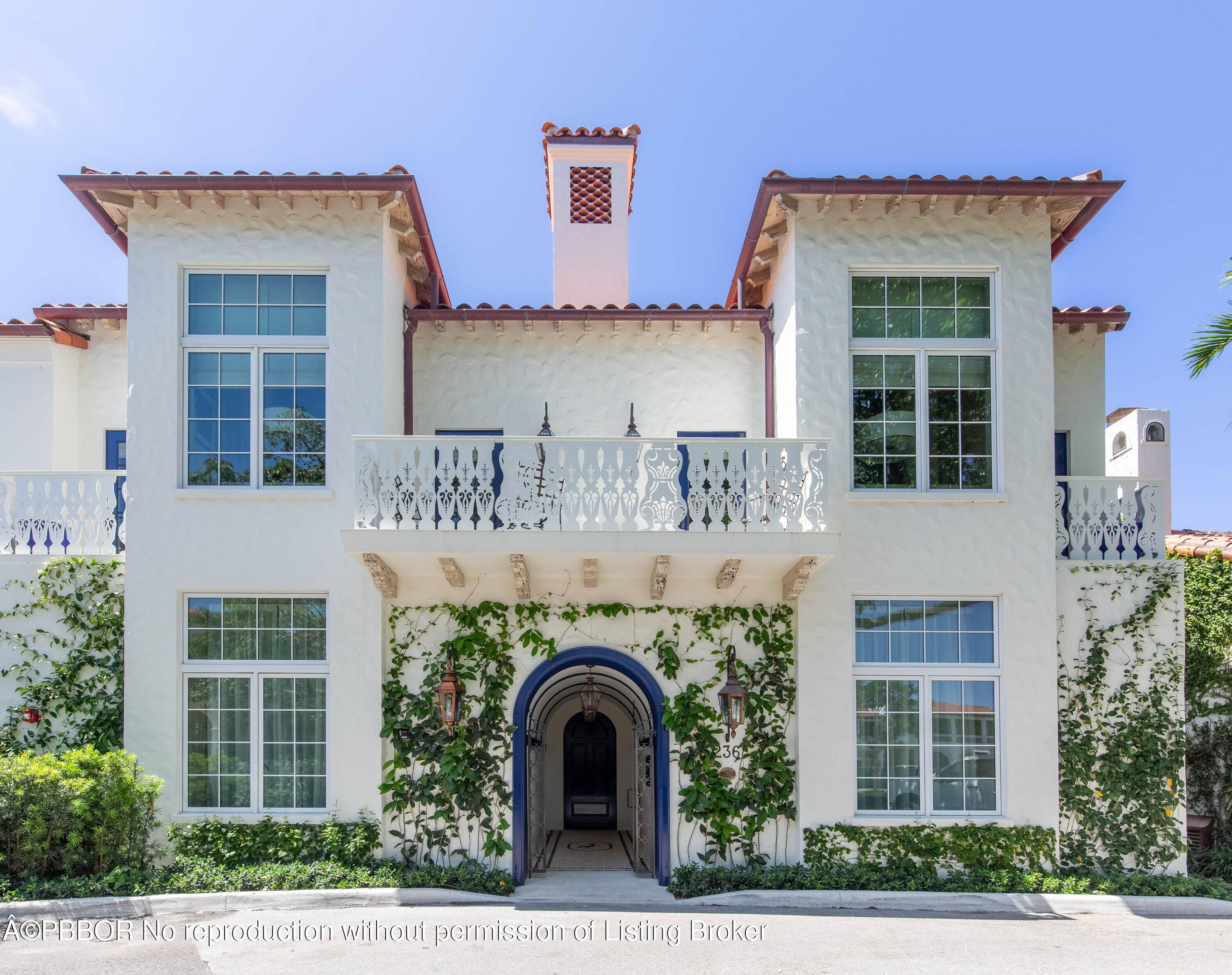 Discover timeless luxury in this rare landmarked jewel tucked within Palm Beach's exclusive Phipps Plaza.