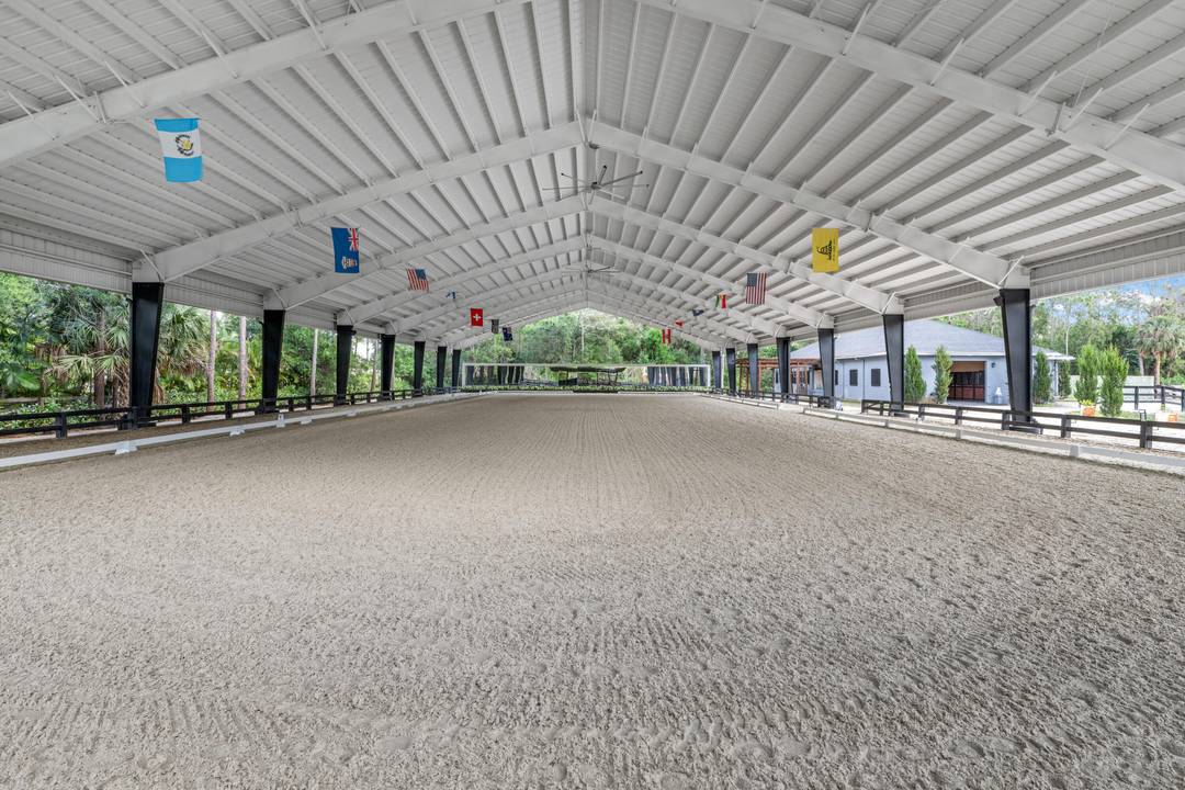 Set beneath a canopy of mature oak trees and just 13 minutes from Wellington International, this exceptional equestrian estate offers a rare blend of top tier equestrian facilities and refined ...