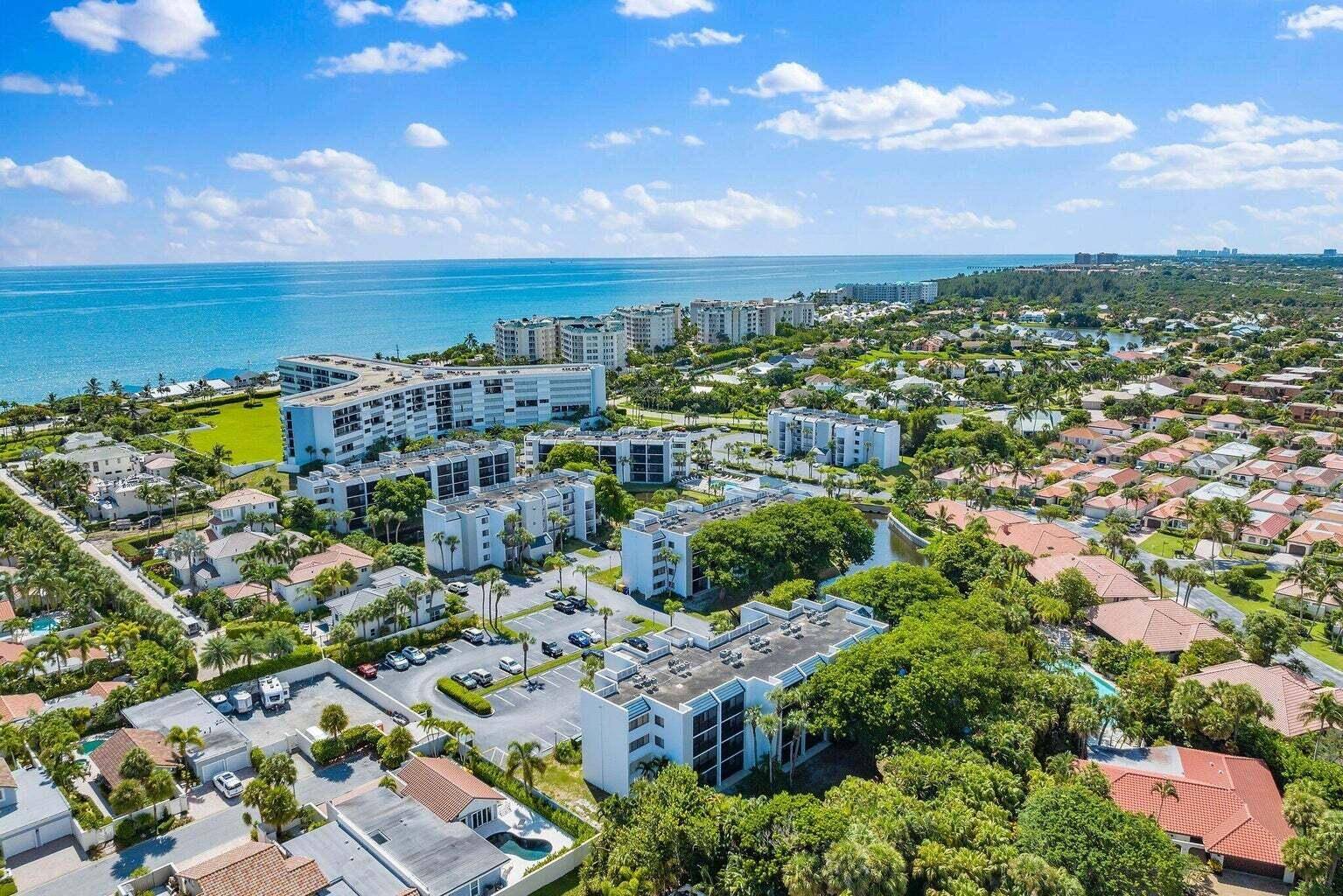 WOW ! Beautiful light and bright 2 bedroom 2 baths ground floor corner no stairs residence in Jupiter Ocean and Racquet Club.