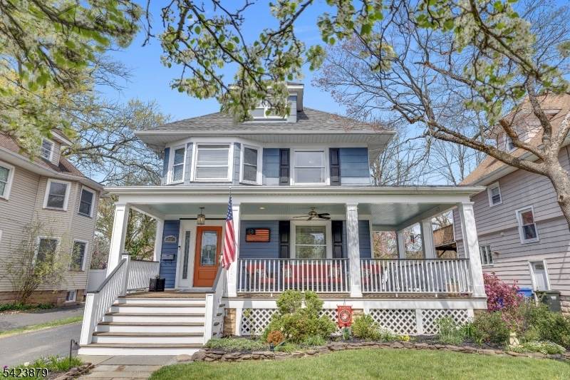 This beautifully maintained turn of the century Colonial welcomes you with an inviting front porch and timeless charm.