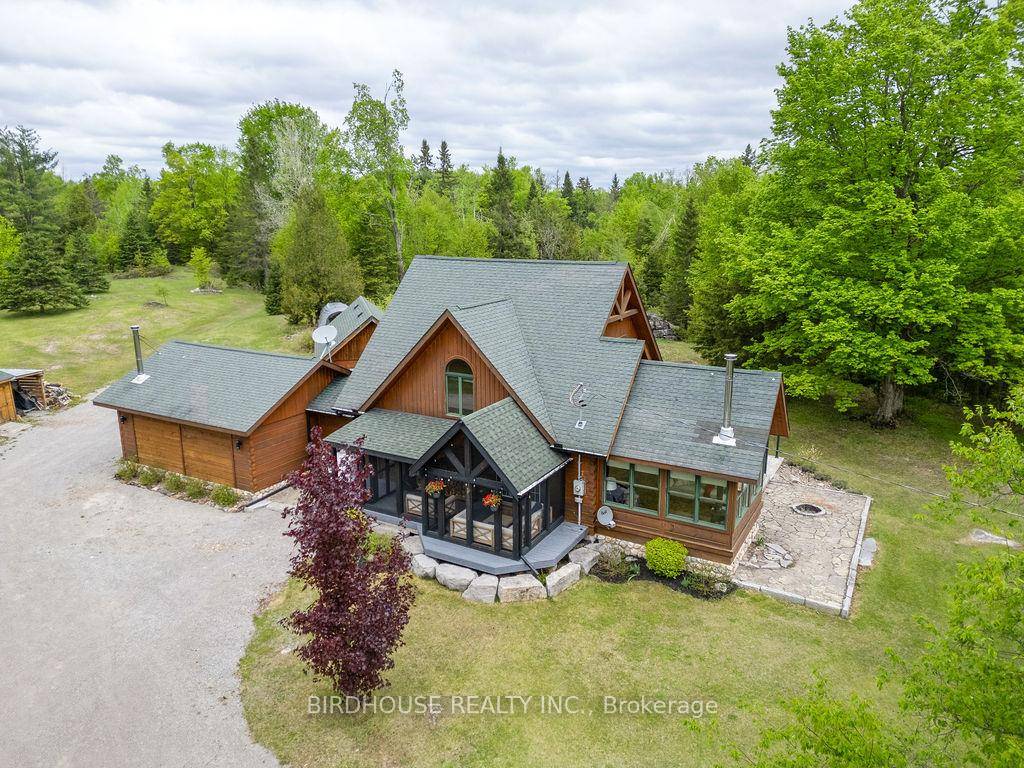GPS 246 9th Concession Rd, Burnt River Confederation Log home completed in 2010 nestled on a private 2.