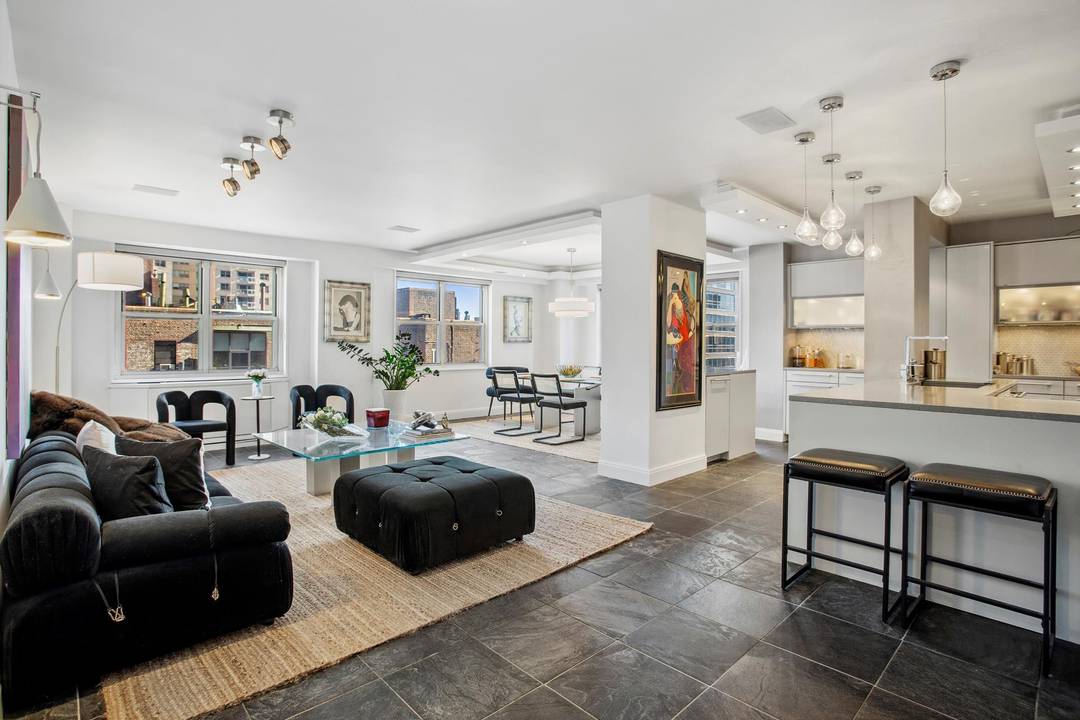 This exceptional corner unit welcomes you into a luxurious, spacious living space filled with natural light and expansive views of the New York City skyline.