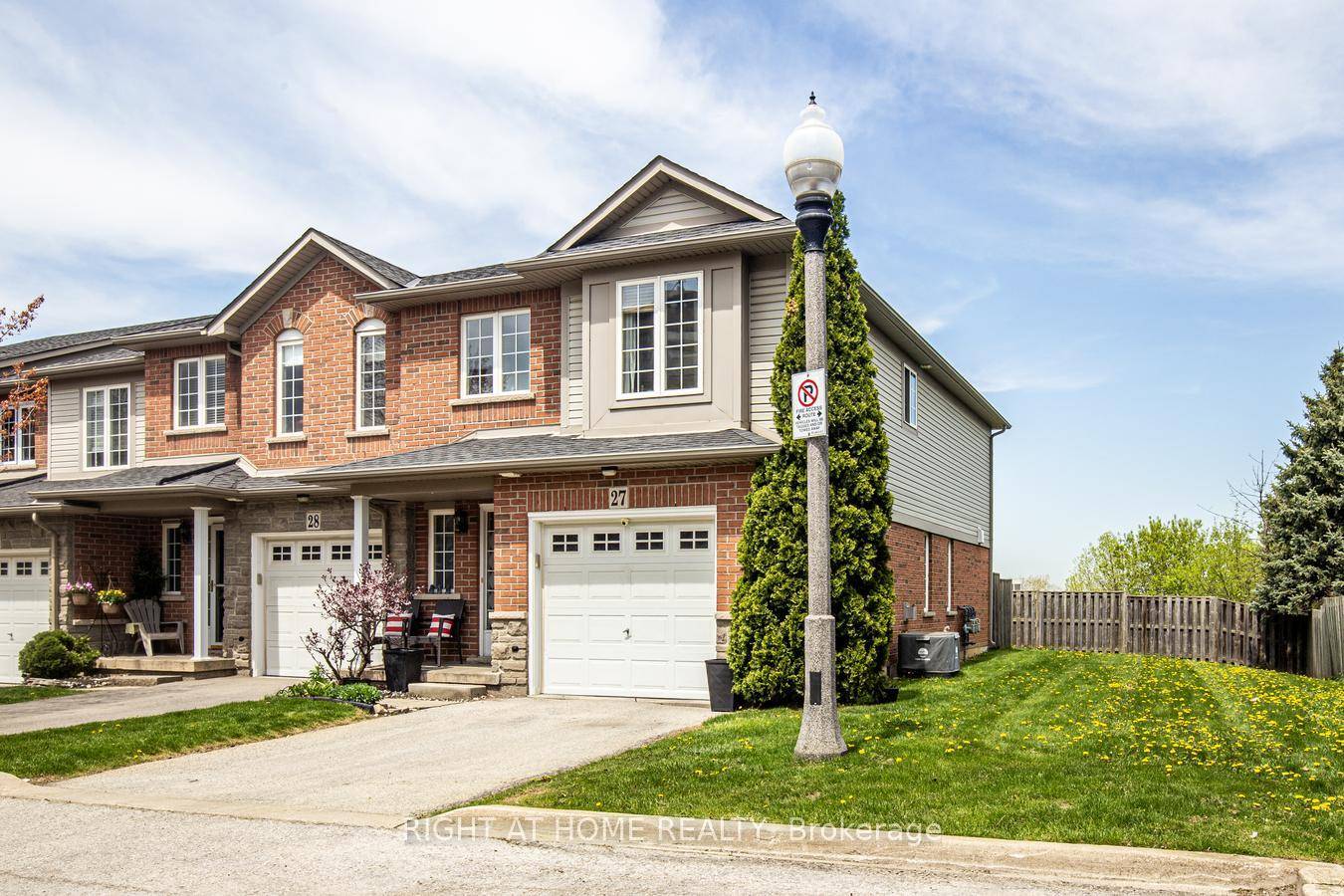 This Large END UNIT Townhome Is a True Gem, Featuring a Beautifully Landscaped Backyard With an Manicured Garden and A Private Garage.