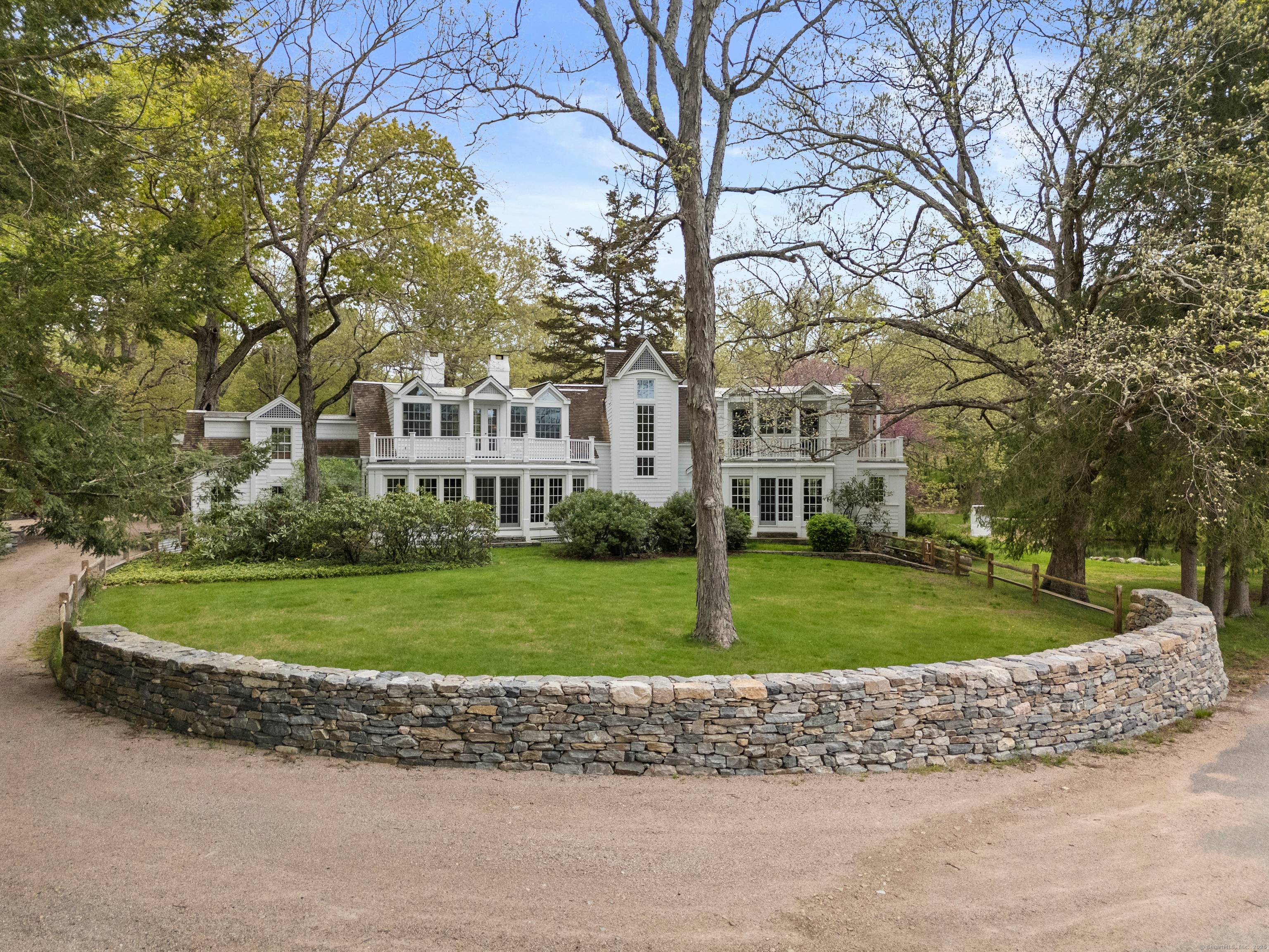 Experience the grandeur of this private estate, where the tranquil Eight Mile River flows beside a beautifully restored home.