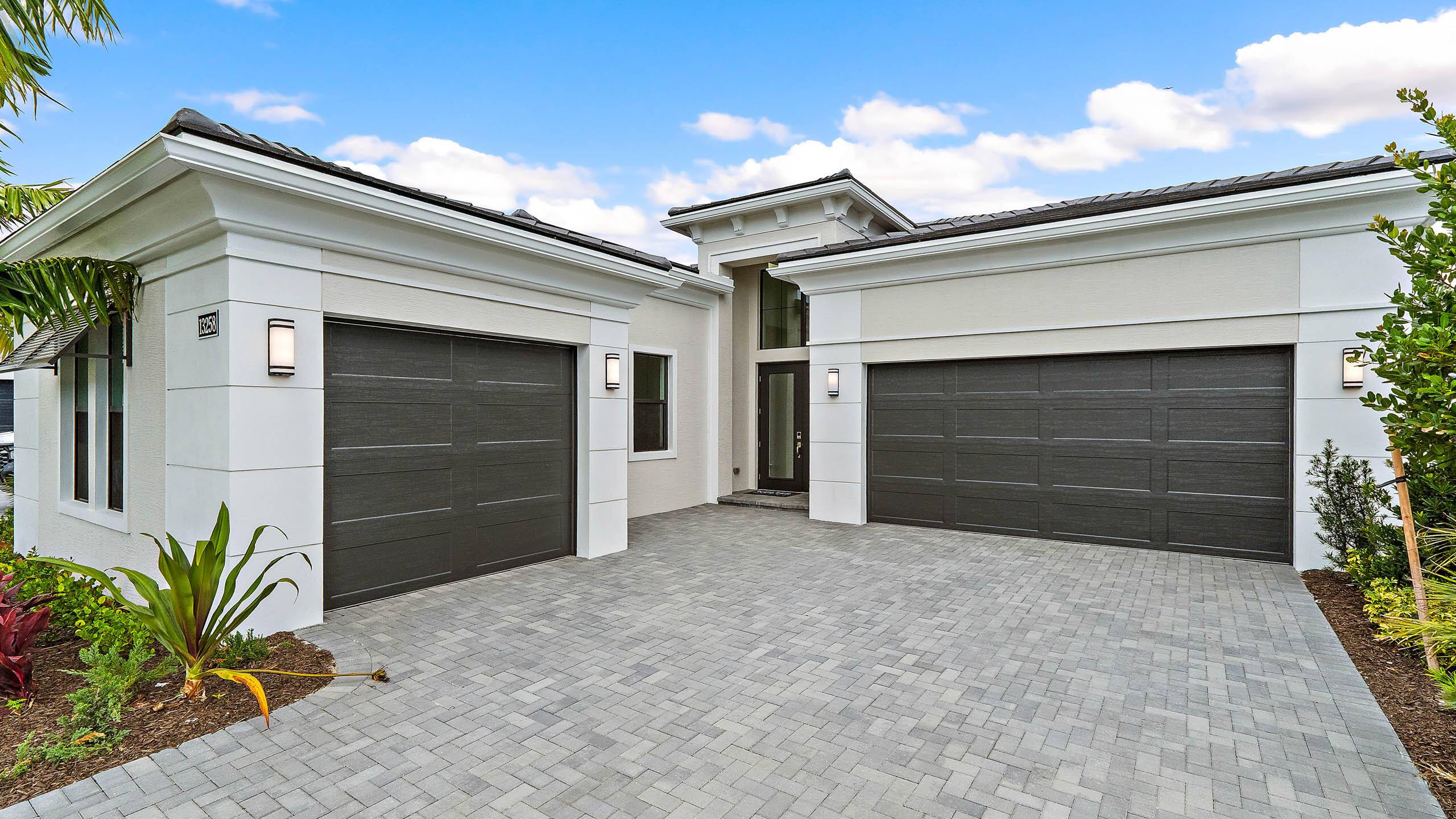 NEW CONSTRUCTION Move in ready new construction by Kolter Homes featuring the Michelangelo floorplan on a preserve homesite in the gated community of Artistry Palm Beach.