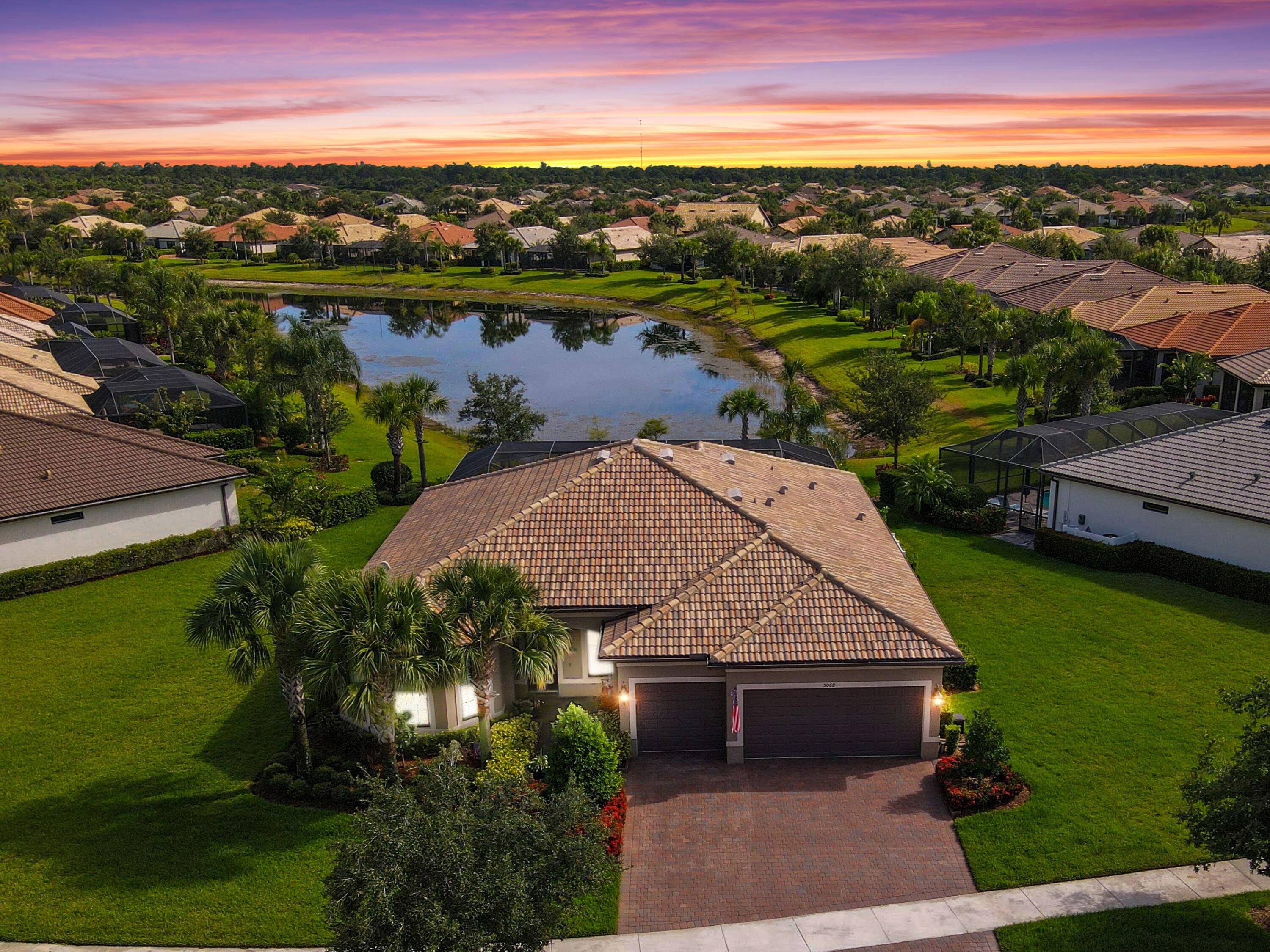 Beautifully appointed and maintained 2017 Pinnacle model with long lake view in sought after Lakes at Waterway Village.