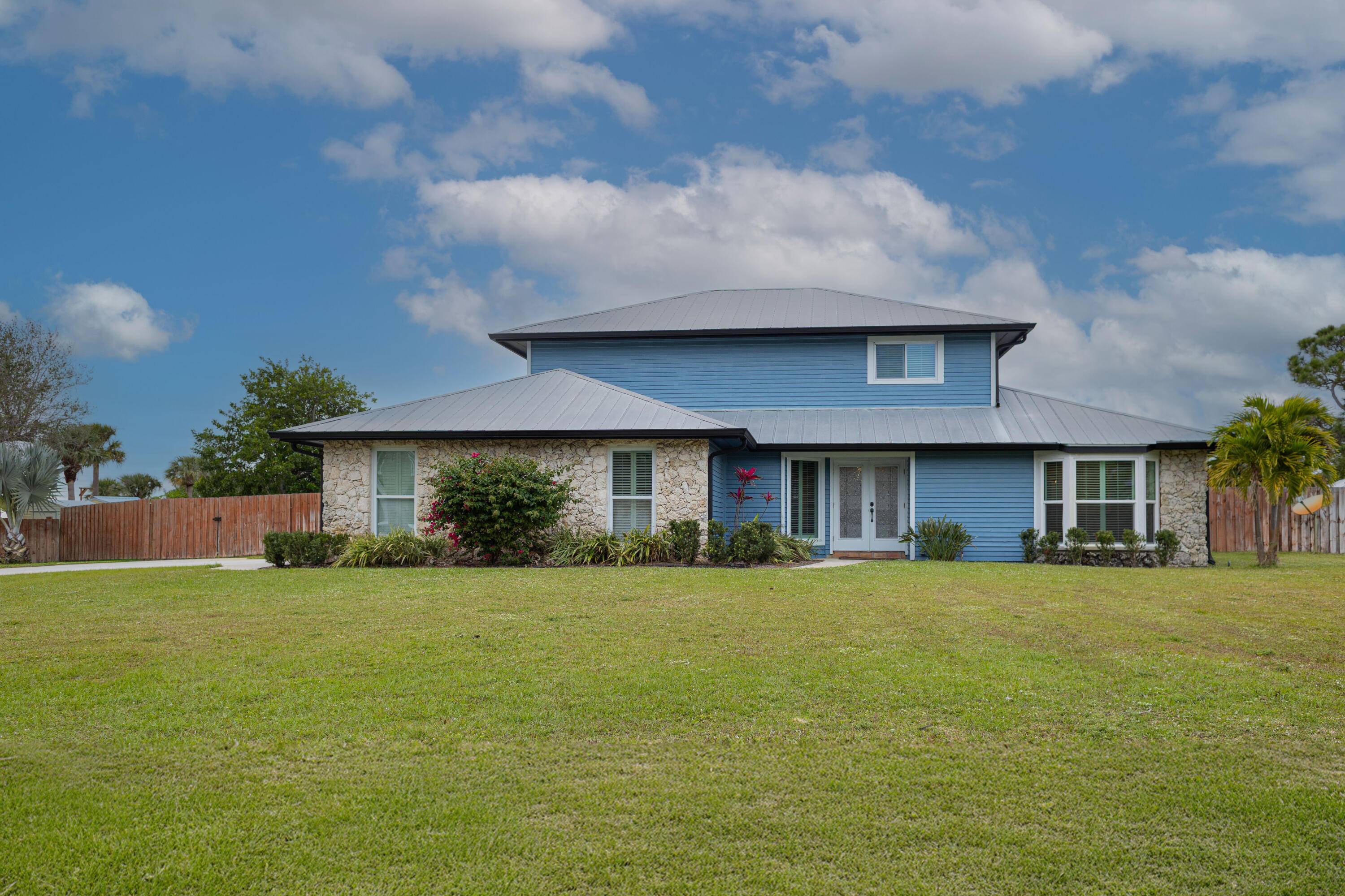 Welcome to this 3 3 plus bonus room pool home on over half an acre and private dock !