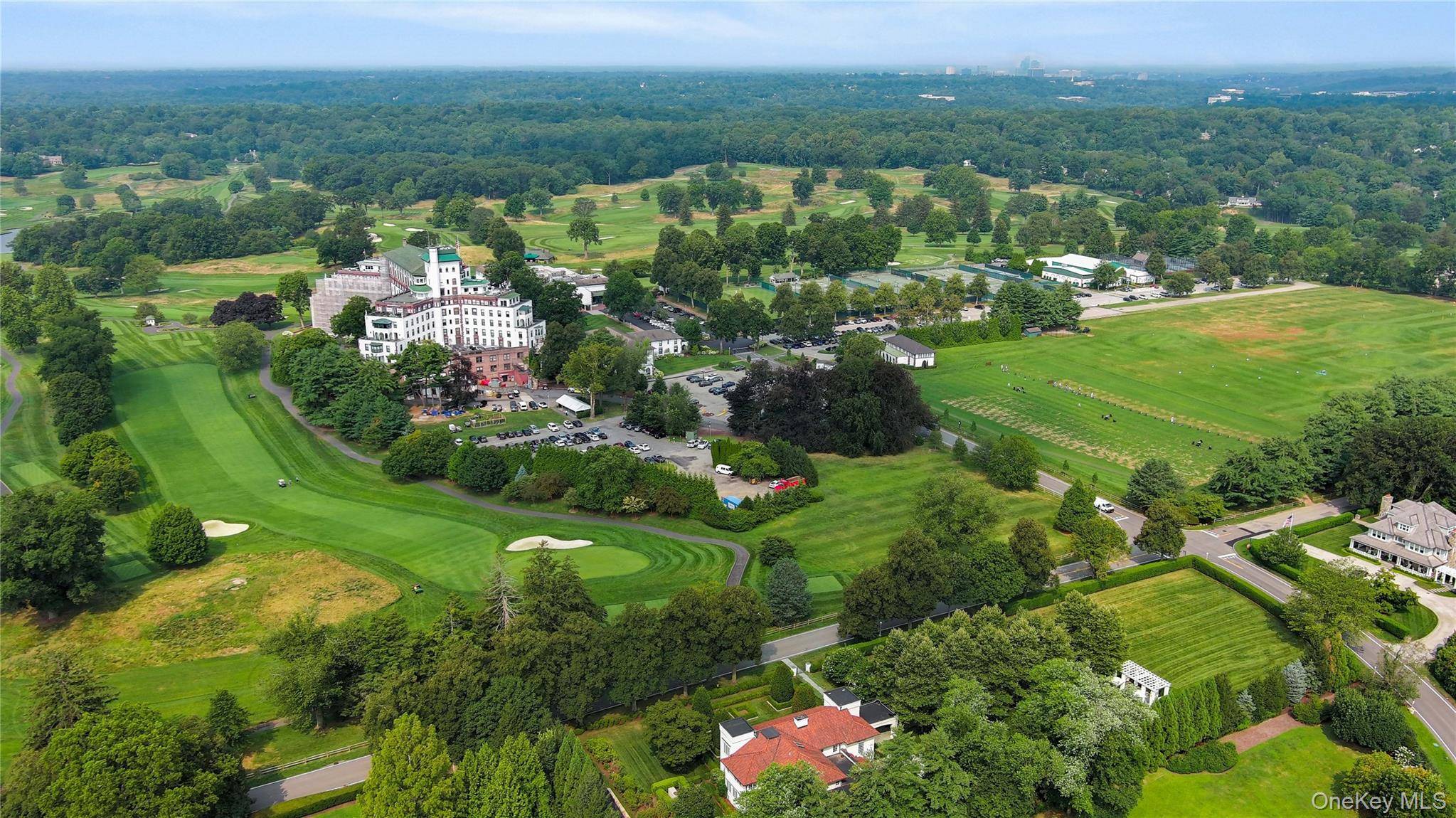 Iconic and admired Westchester Country Club gem on prime double lot with breathtaking views of golf course and main clubhouse.