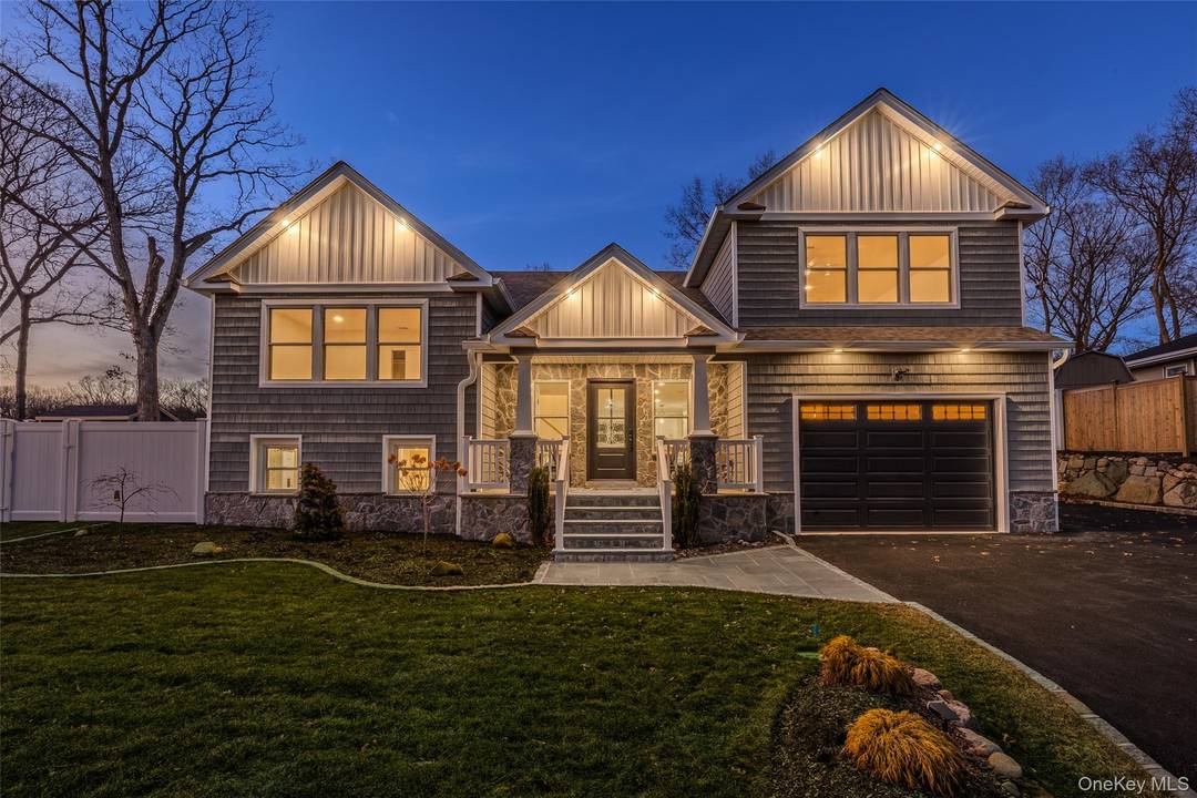 Welcome to this completely renovated and expanded split ranch located in the highly sought after Smithtown School District.