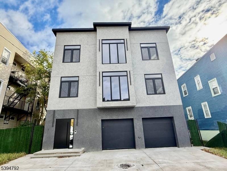 A True Showstopper ! This breathtaking two family residence sets a new standard for modern living in Irvington, NJ.