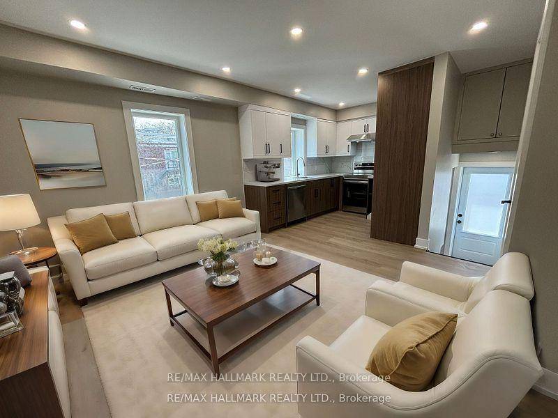 Welcome to this sun filled, fully renovated 2 bedroom unit in a legal triplex located in a highly desirable Toronto neighborhood !