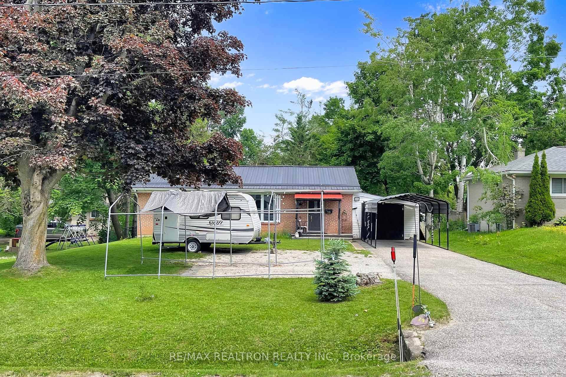 Solid 2 bedroom bungalow located in a quiet family neighborhood Can be easily converted to Three Bedrooms Newly Renovated Modern Kitchen Laminate Floor Throughout Newer Bathroom Bright Living room with ...