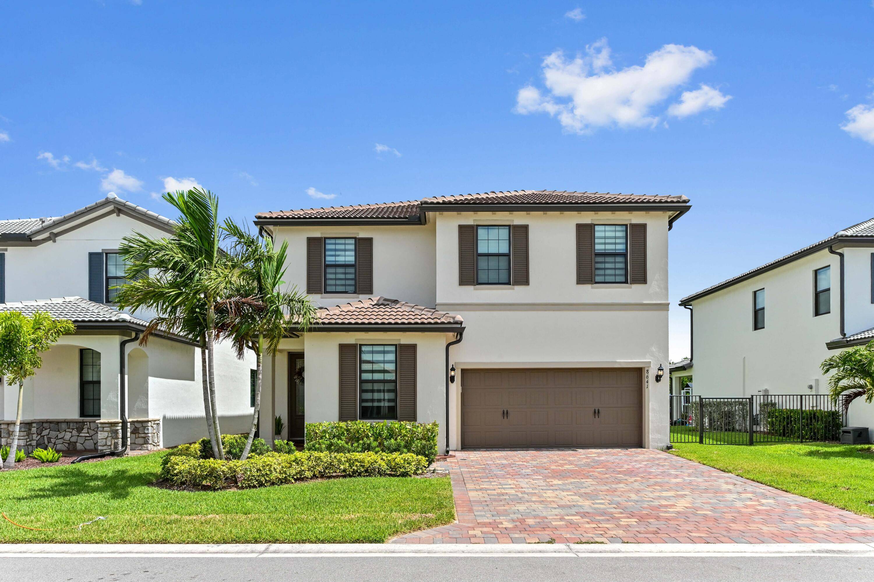 Welcome to an exceptional lifestyle within the prestigious gated community of The Fields at Gulfstream Polo in Lake Worth, FL.