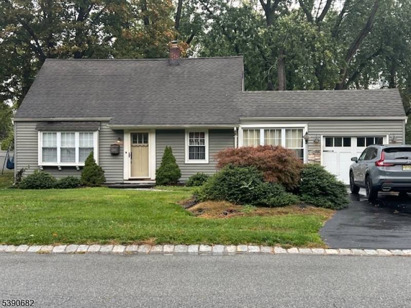 Classic and Charming Cape Cod home, beautifully blending vintage charm with modern comfort.