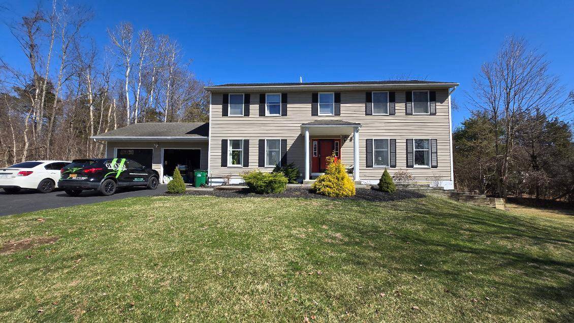 A sweeping front lawn sets the stage for this stunning 4 bedroom, 3.
