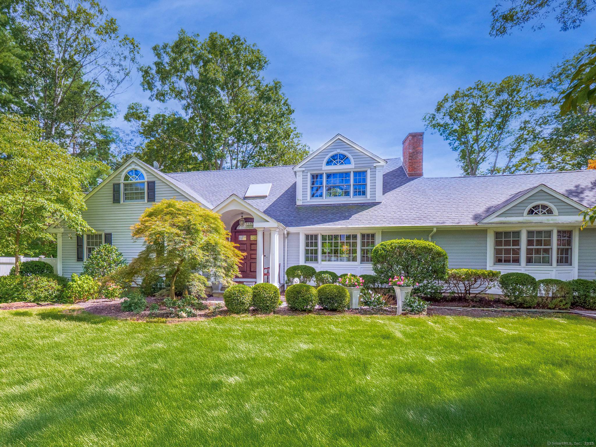 Welcome to 9 Singing Woods Road, a stunning Silvermine 4 5 bedroom home where lush grounds, elegant interiors, and a resort style pool create the perfect retreat.