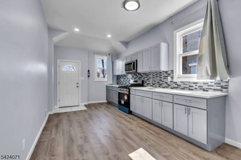 Renovated two family home in a prime East Orange location, offering approximately 2, 133 sq ft of living space on a 4, 831 sq ft lot.