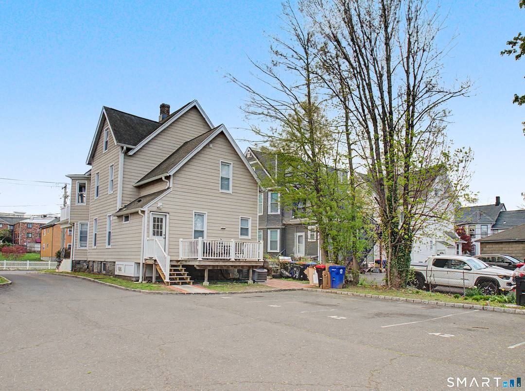 2 detached two family houses on a tree lined street in a quiet norwalk neighborhood.