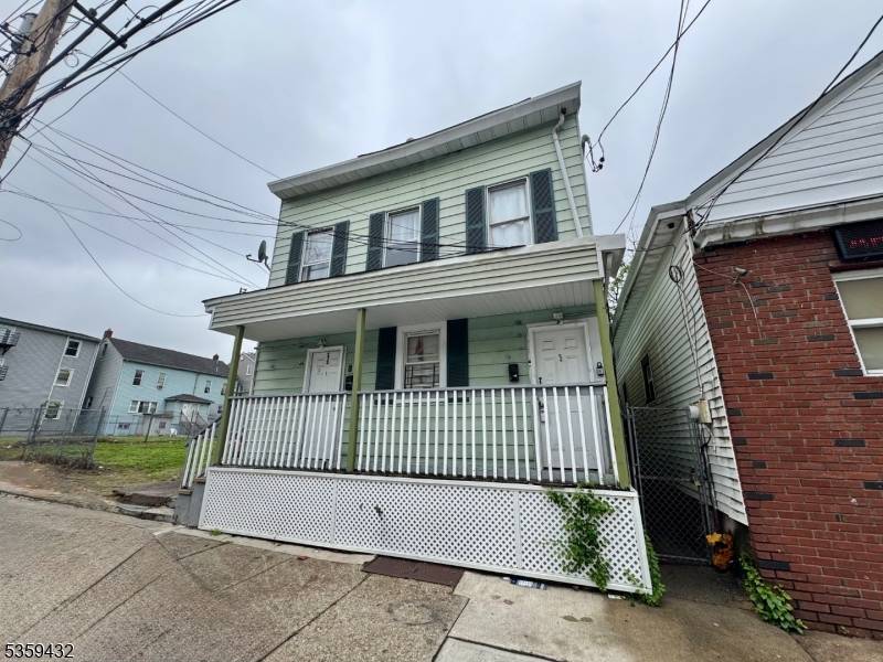 Recently Renovated Two Family Home 2nd Floor Vacant Move in Condition Residentially located Features Central Heat, Hardwood Floors much more