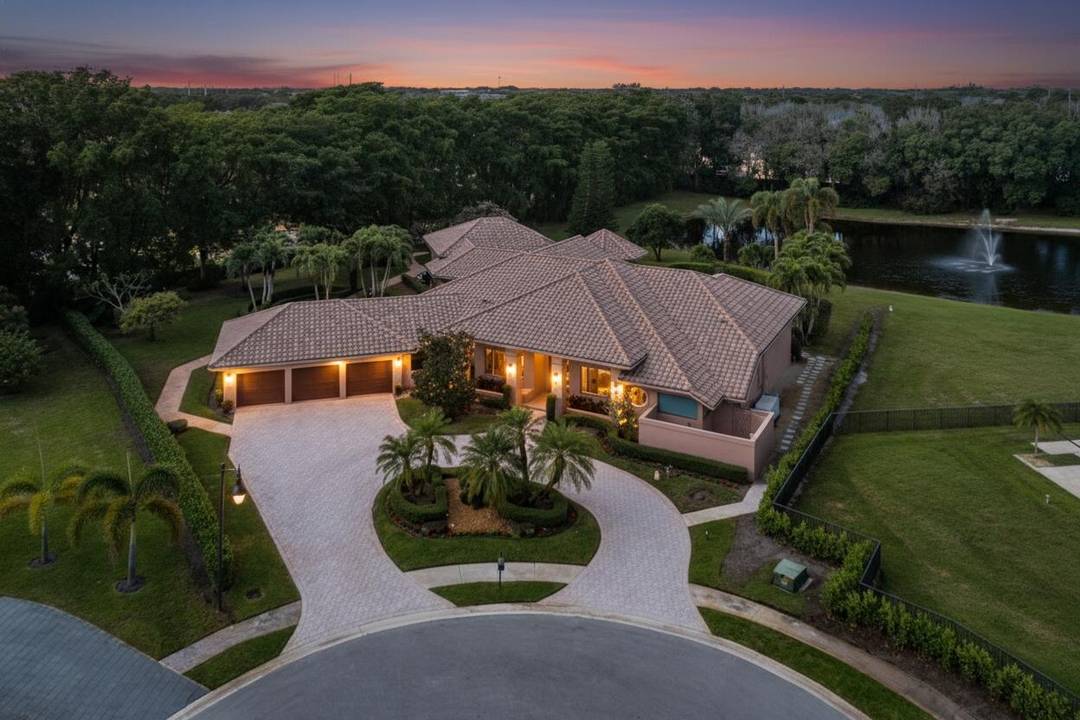 Welcome home to this sprawling executive estate in the exclusive, boutique community of Bocaire Country Club.