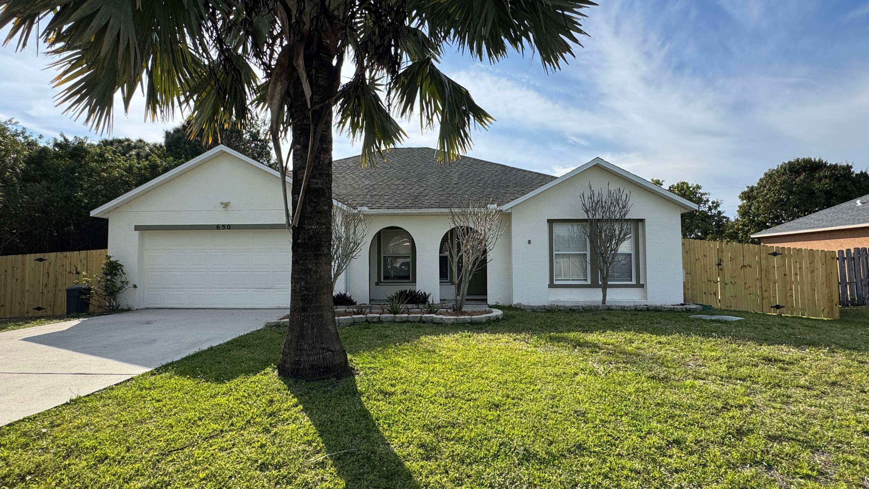 This classic home features a CBS 3 2 2 configuration, showcasing an expansive living room, family room with stunning wood floors and a picturesque window, dining area, and open kitchen ...
