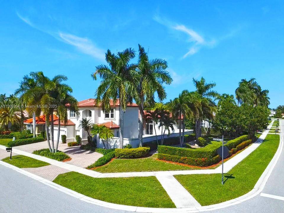 Elegant 5 bedroom, 4 1 2 bath 2 story residence in gated The Shores at Boca Raton.
