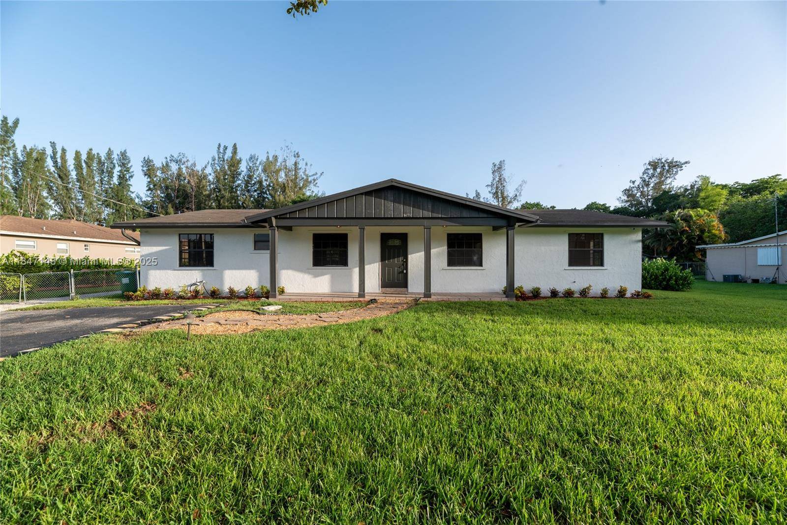 This beautiful 3 Bedroom, 2 Bath ranch style oasis invites you into bright, open interiors set on lush, expansive grounds.