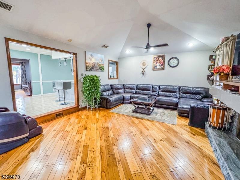 Charming ranch style home offering convenient one floor living with 3 spacious bedrooms including a primary suite, 3 full bathrooms, a versatile entertainment room, and beautiful hardwood flooring throughout.