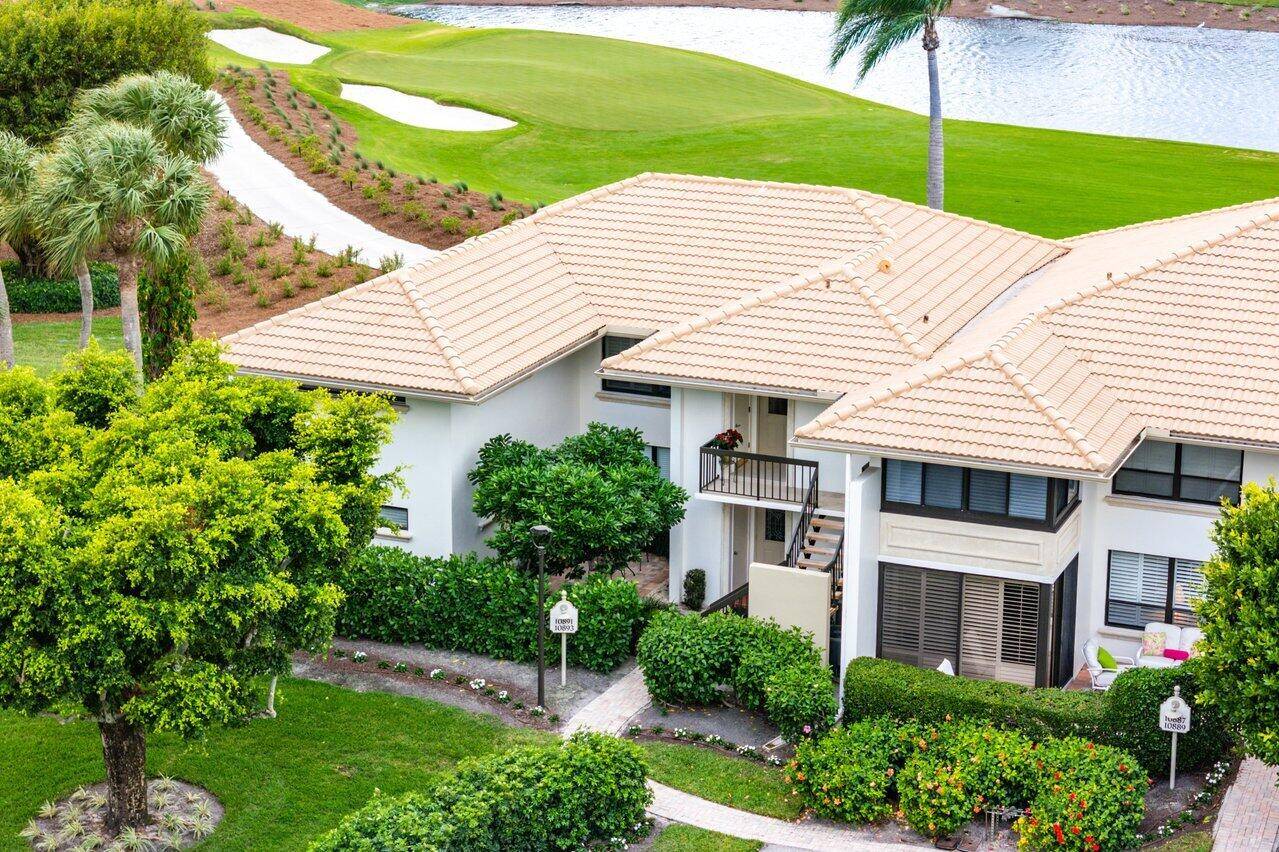 Step into this beautifully updated 2nd floor corner condominium offering breathtaking views of serene lakes and double fairway golf course.