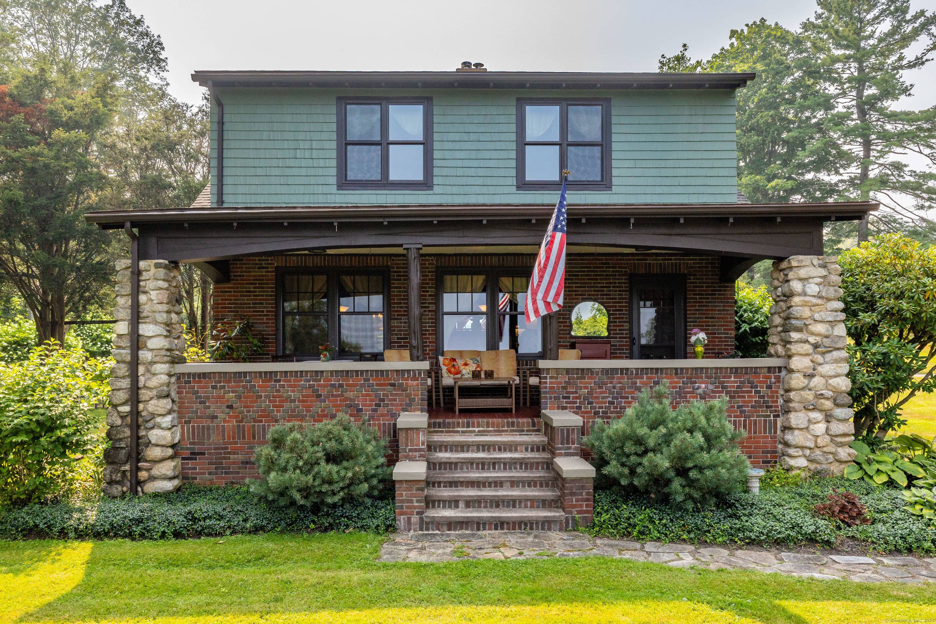 This fully dormered Craftsman style cape overlooking Lake Pocotopaug will captivate you with rich character original period details, a 3 car garage, barn, brook, woods, and enchanting gardens all set ...