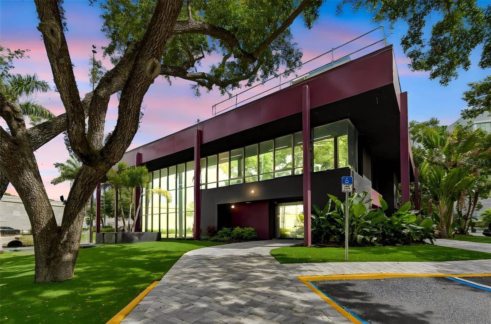 Positioned along one of Tampa Bay s most traveled commercial corridors, this striking modern office property offers a rare blend of architectural presence, functionality, and long term investment stability.