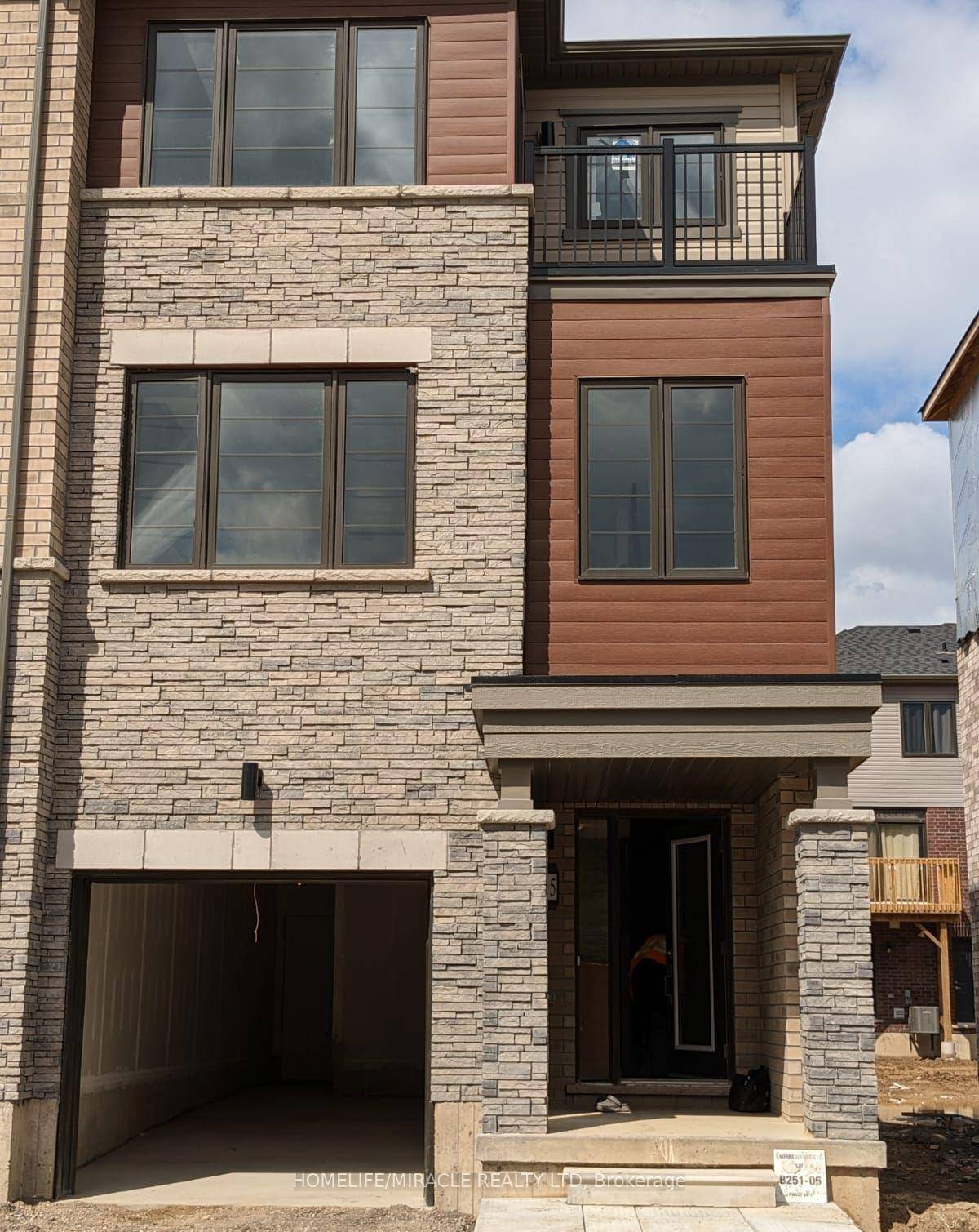 Welcome to 215 Gillespie Drive A Stunning End Unit Freehold Townhome in West Brant !
