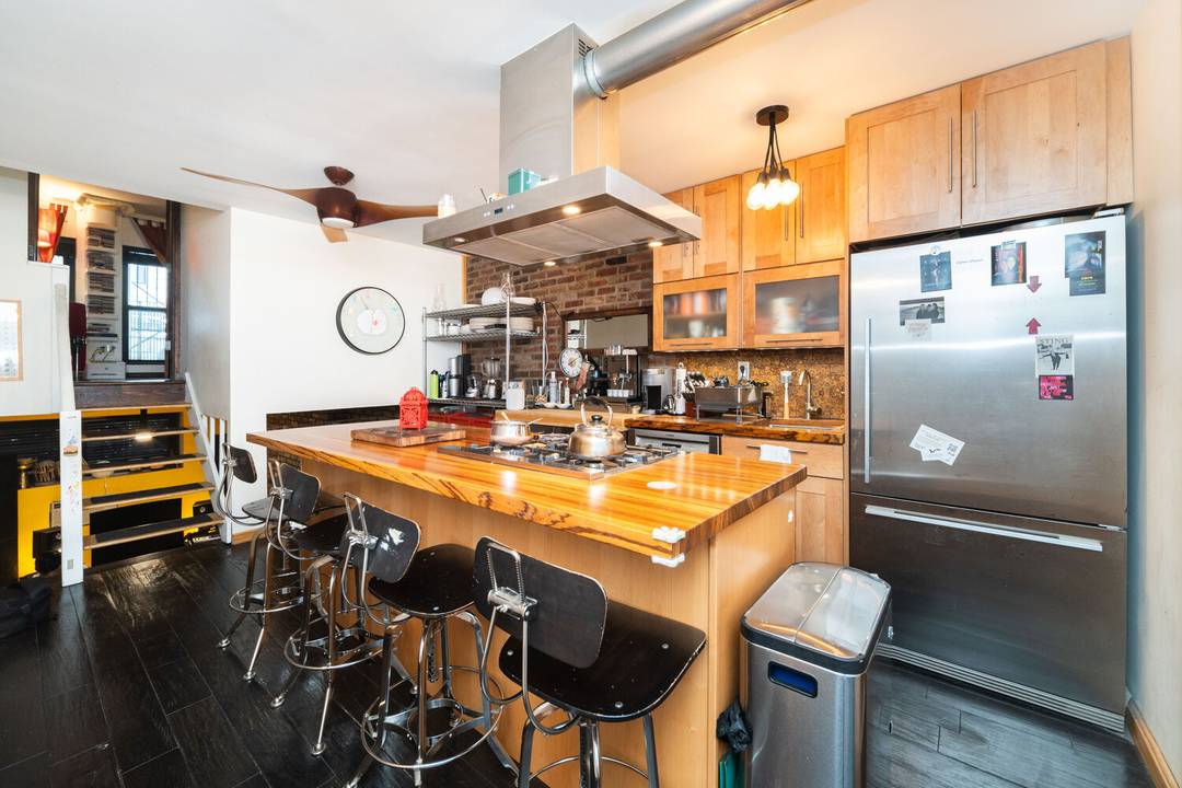 Residence 1B at 49 East 12th Street presents a rare opportunity to own a thoughtfully renovated triplex in the heart of Greenwich Village.