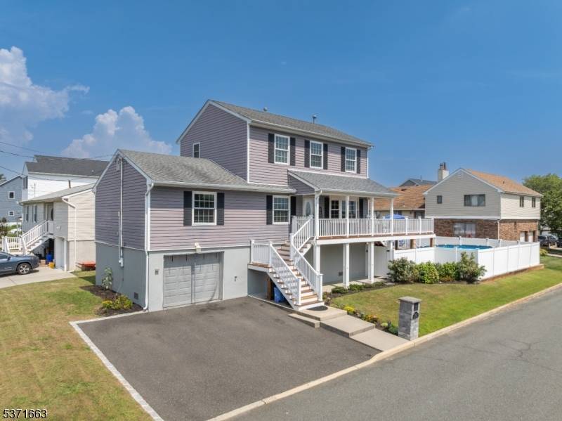 Coastal living meets modern comfort in this beautifully updated home located on a quiet street directly across from a peaceful open space park.