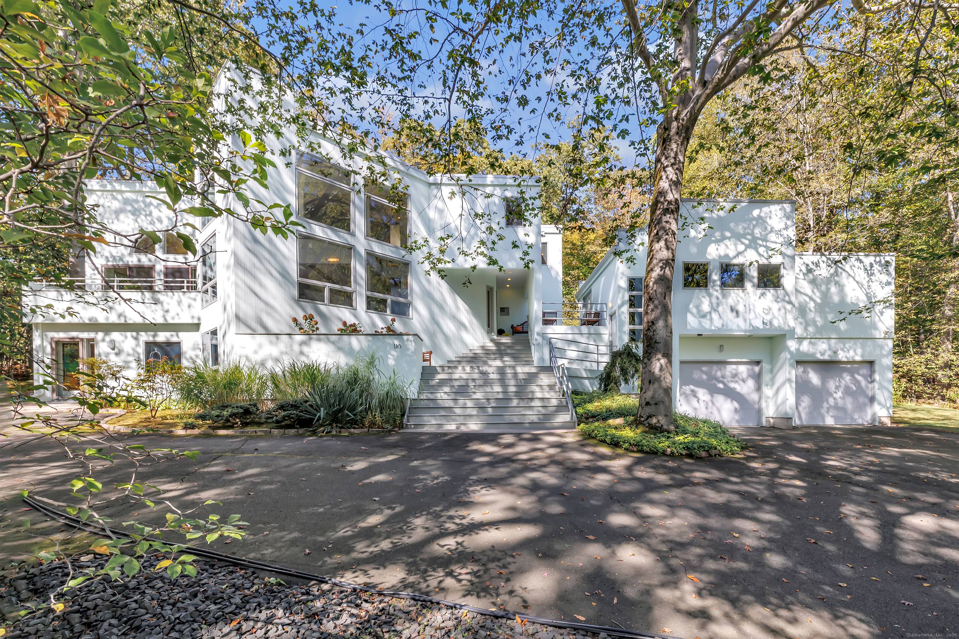 Tucked into the scenic hillside of Hamden's sought after Blue Trail neighborhood on a street lined with architecturally distinctive homes this stunning, one of a kind contemporary offers the perfect ...