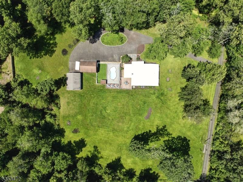 Situated in the coveted New Vernon section of Harding Township, this custom 4 bedroom, 2.