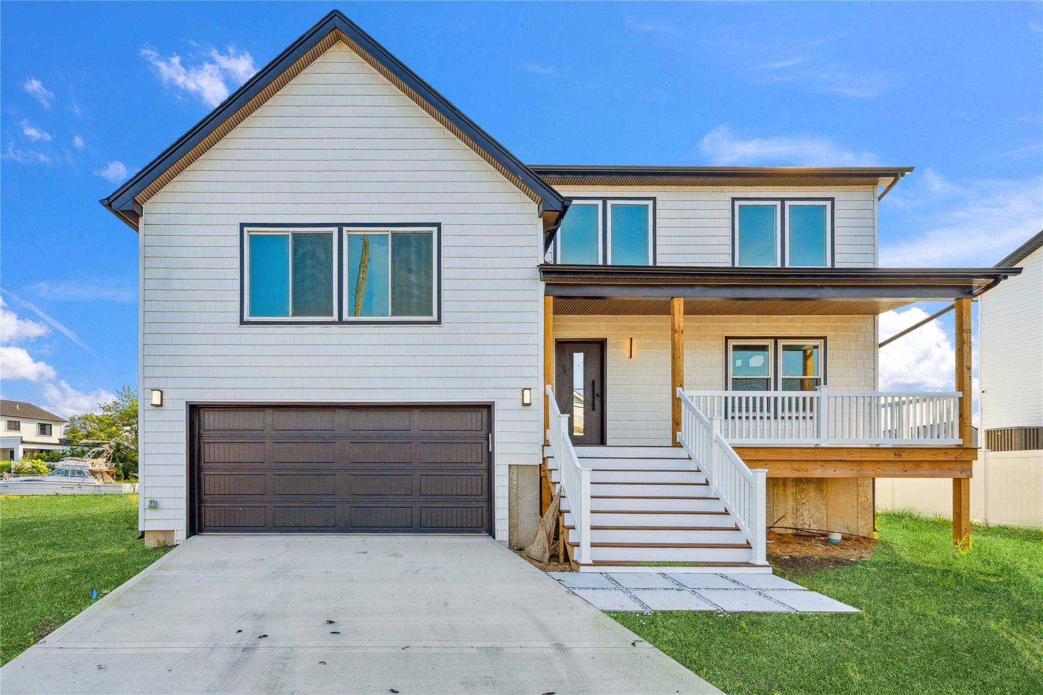 Raised Waterfront Home Bordering Paradise in South Lindenhurst Experience elevated coastal living in this spectacular raised waterfront retreat, perfectly positioned along the serene canals of South Lindenhurst.