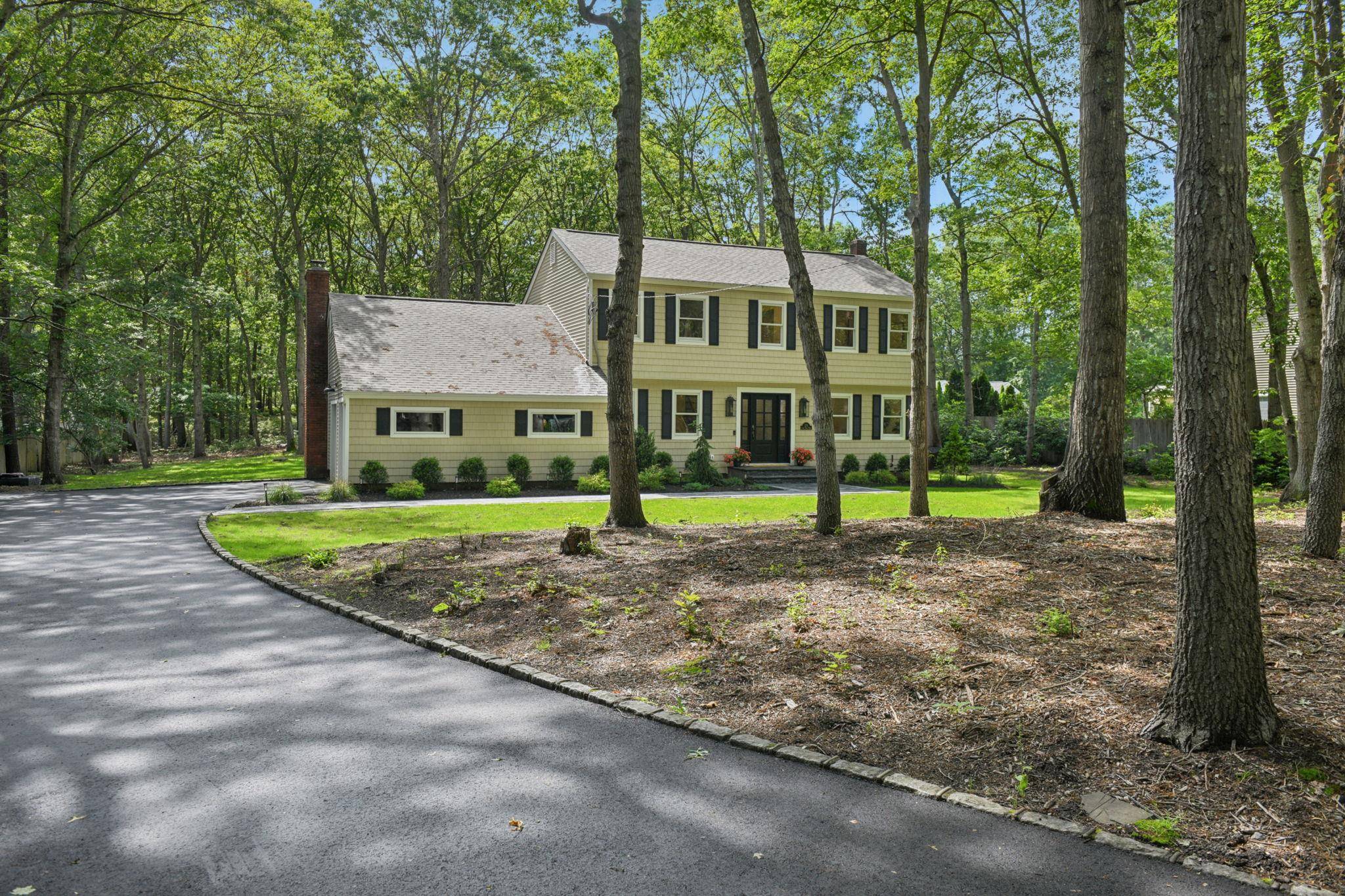 Welcome to The House on Long Pond where timeless design and expert craftsmanship come together on a peaceful wooded acre in the heart of Wading River.