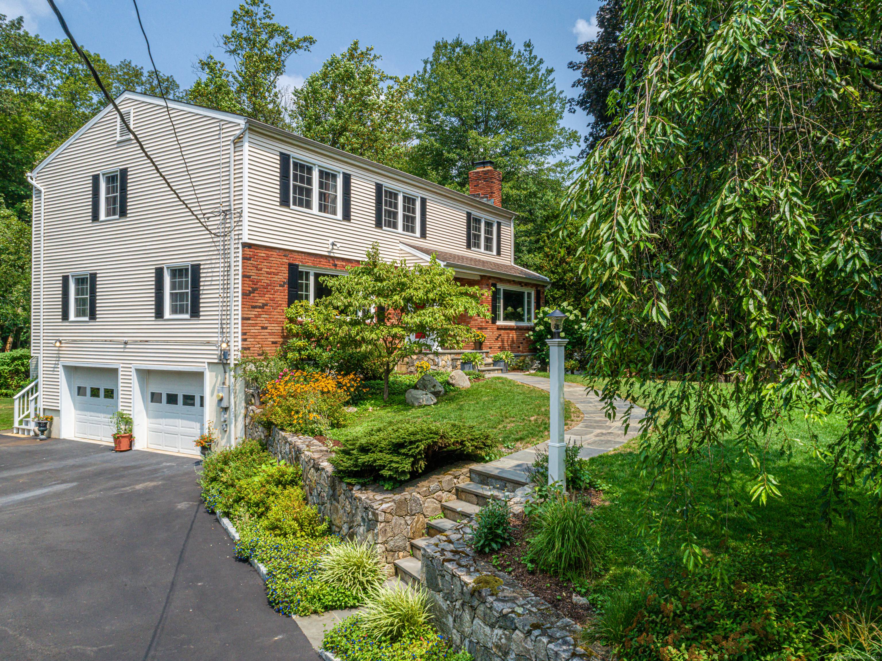 Welcome to 65 Malibu Road, a beautifully updated Colonial set on a quiet cul de sac in desirable North Stamford.
