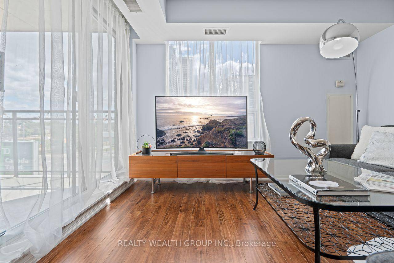 This spacious and bright 2 bed, 2 bath corner unit condo offers an exceptional layout with a windowed kitchen, open living and dining area, and plenty of natural light throughout.