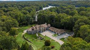 Perched on 10 waterfront acres of lush grounds and mature landscaping, this architectural masterpiece is unrivaled in the juxtaposed design of hand cut stone and modern design.