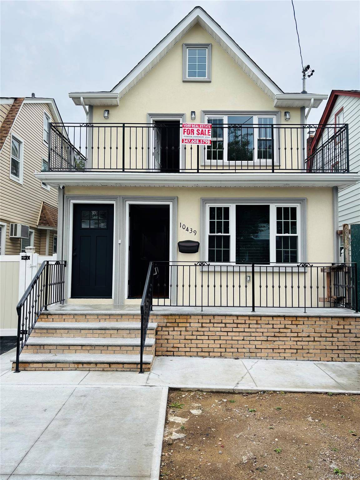 This beautiful new construction 2 family home offers five bedrooms and five full bathrooms with an inviting front balcony.