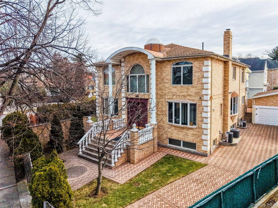 Step into timeless elegance in this beautifully appointed center hall colonial house located in the heart of the prestigious Jamaica Estates area.