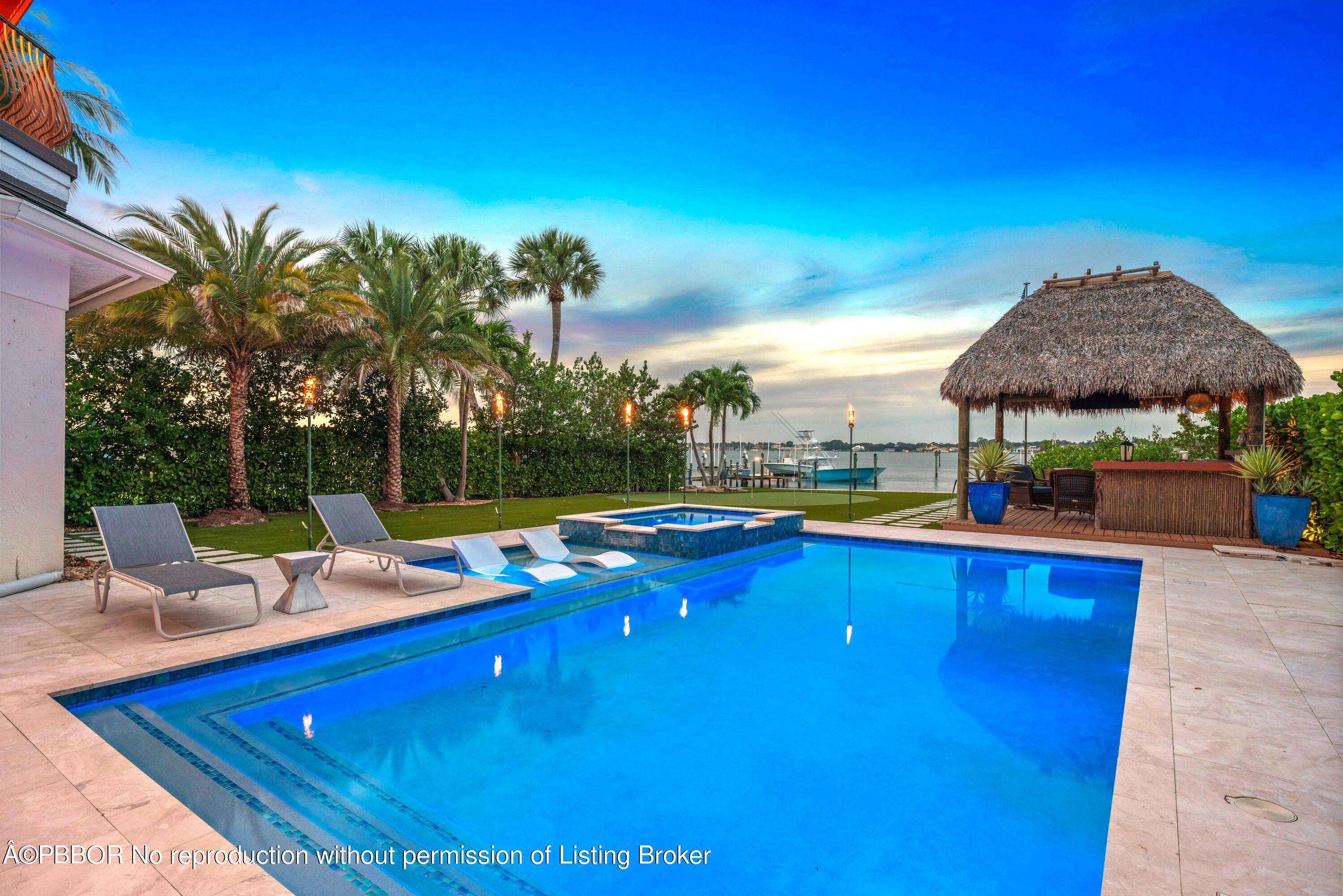 A unique residence positioned with sweeping river views of the serene blue waters of the Loxahatchee River.